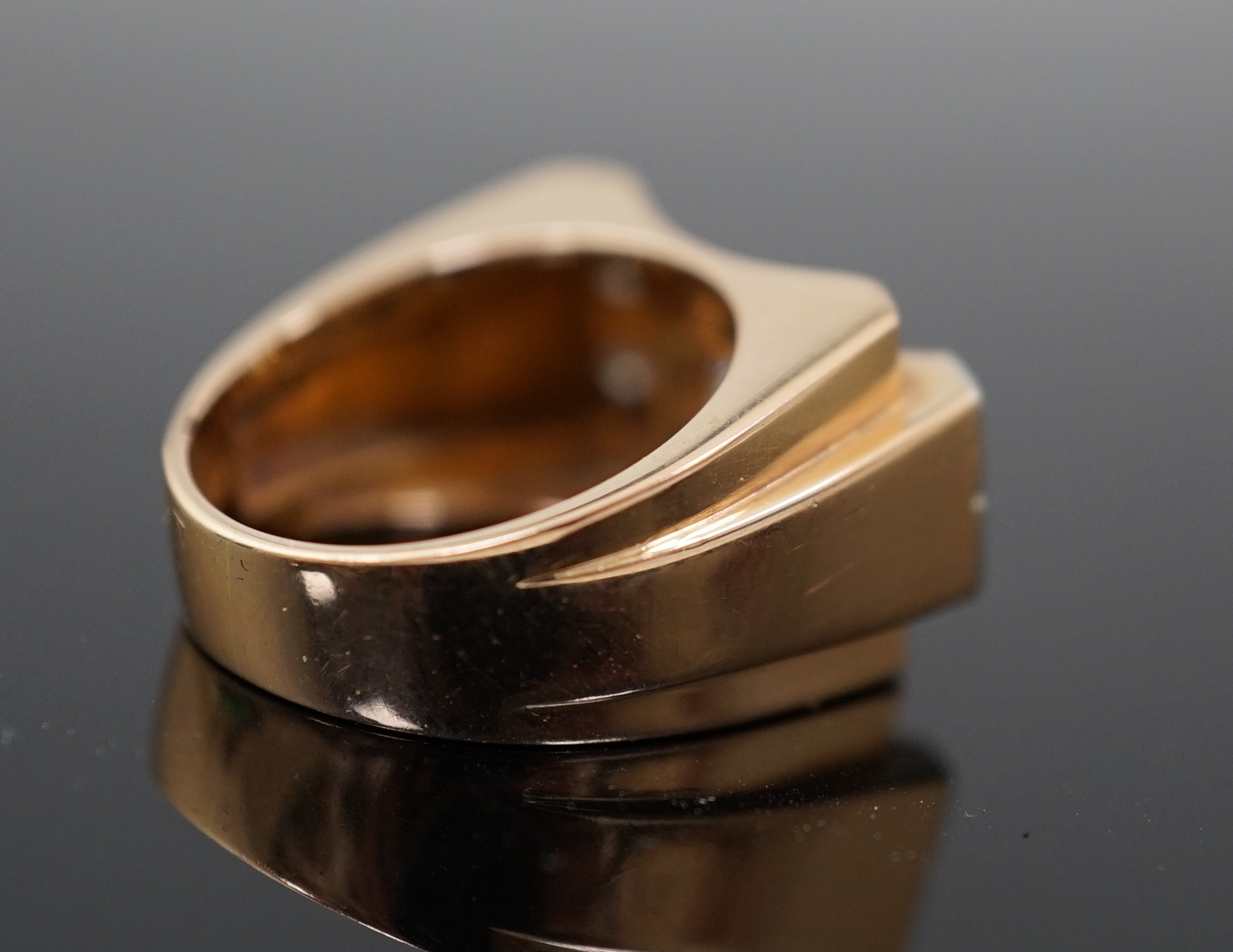 A 1940's 18ct gold and four stone diamond set 'tank' dress ring